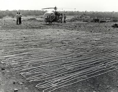 Helicopter with rope to measure sinkhole depth